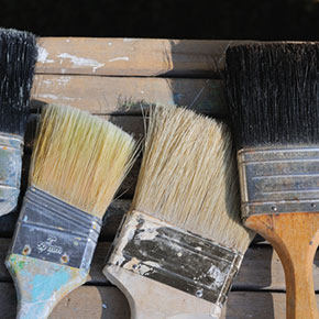 Clean hardened paint brushes